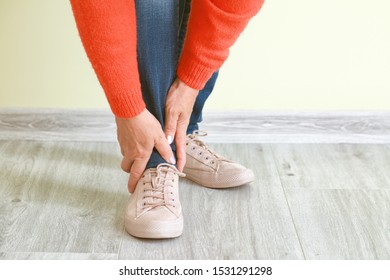 Mature Woman Suffering From Pain In Leg Indoors, Closeup