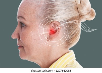 Mature Woman With Symptom Of Hearing Loss On Color Background. Medical Test