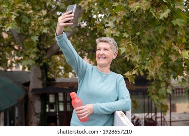 Mature Woman Taking A Selfie During Jogging