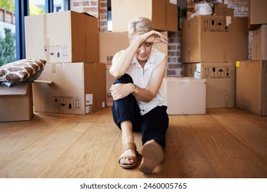 Mature woman, tired and boxes in new home, burnout and exhausted on floor, moving and sad for leaving. Rent, apartment and person in property, rest and thinking of mortgage of house, stress and wood - Powered by Shutterstock