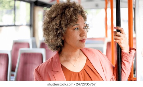 Mature woman traveling to work by a bus - Powered by Shutterstock