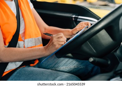 Mature Woman Truck Driver Steering Wheel Inside Lorry Cabin. Happy Middle Age Female Trucker Portrait 