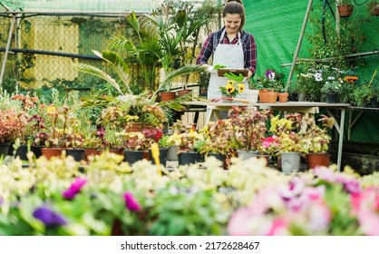 Mature Woman Using Tablet Computer Inside Greenhouse Garden - Nursery And Spring Concept - Focus On Face