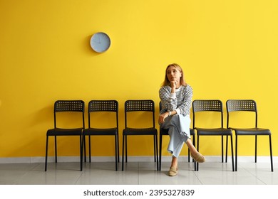 mature woman waiting for her turn in room
