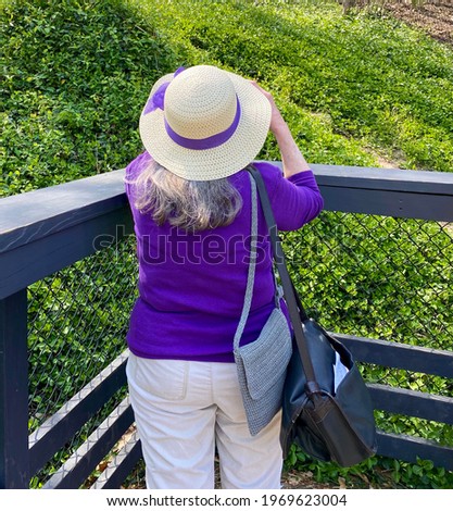 Mature woman wearing in purple