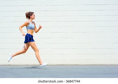 Mature woman working out in an urban setting, from a complete set of photos. - Powered by Shutterstock