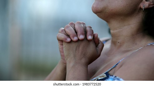 Mature Woman Worshiping God. Hispanic Person Praying To Divine Spiritual Protection