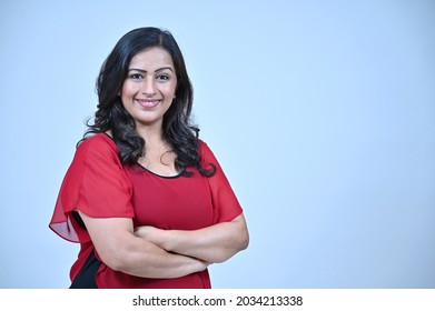 Mature Women In Red Casual Top, Smiling Pose In  Portrait Shot In Studio