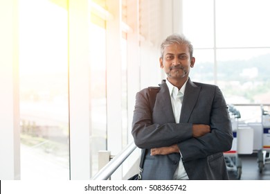 Matured Indian Business Male Walking At Airport

