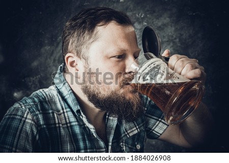 Similar – Image, Stock Photo Portrait of a young man with a beer glass in his hand