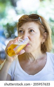 Matured Year Old Woman Drinking Beer 