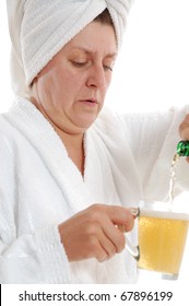 Matured Year Old Woman Drinking Beer In Sauna. Isolated Over White.