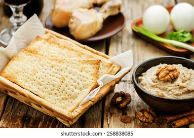 Matzah, Wine, Eggs, Chicken, Greens And Haroset On A Dark Wood Background, Traditional Food For The Pesach. Tinting. Selective Focus