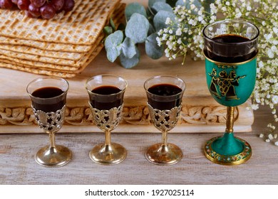 Matzoh passover jewish holiday celebration matzoh with kiddush four cup of red kosher wine