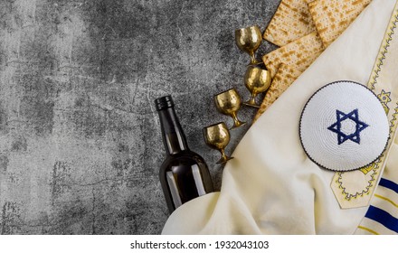 Matzoh, Silver Seder Plate And Kosher Four Cup Wine For Jewish Passover Background.