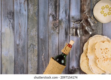 Matzoh, Silver Seder Plate And Kosher Four Cup Wine For Jewish Passover Background.