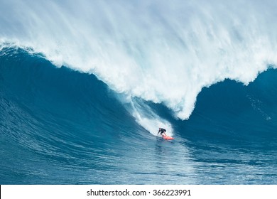 MAUI, HI - JANUARY 16 2016: Professional Surfer Will Hunt Rides A Giant Wave At The Legendary Big Wave Surf Break Known As 