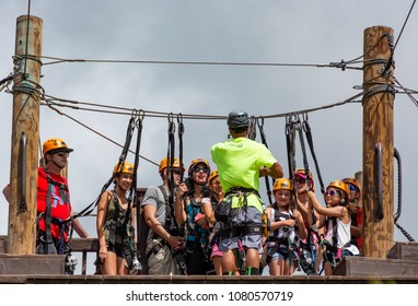 MAUI, HI/U.S.A. - JULY 18, 2015: A Group Of Zipliners Listen To The Directions Given By Their Instructor At The Maui Tropical Plantation 