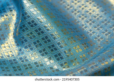 Mauled Blue-colored Fabric Texture Background. This Brocade Fabric Is Made Of Polyester.