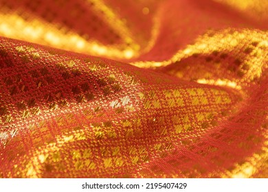 Mauled Red-colored Fabric Texture Background. This Brocade Fabric Is Made Of Polyester.