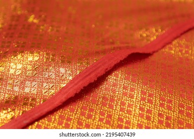 Mauled Red-colored Fabric Texture Background. This Brocade Fabric Is Made Of Polyester.