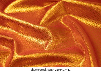 Mauled Red-colored Fabric Texture Background. This Brocade Fabric Is Made Of Polyester.