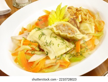 Maultaschen With Meat Stock, Vegetables And Onions