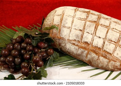 Maundy Thursday Celebration. Bread And Black Grapes Symbolizing The Last Supper Of Jesus Christ. France. 