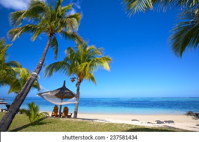 Mauritius Beach With Chairs And Umbrellas