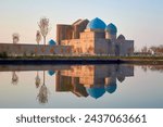 Mausoleum of Khoja Ahmed Yasawi. UNESCO World Heritage Site, Turkestan, Kazakhstan.  Reflection of the Mausoleum in a pond.