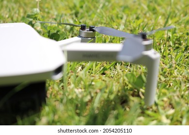 Mavic mini photography drone on grassy lawn.