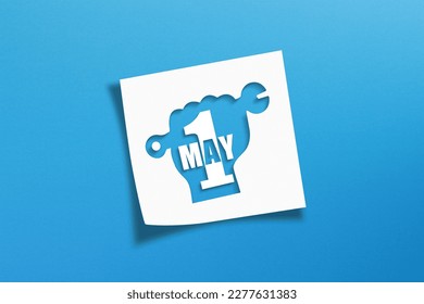 May 1 Labor Day concept on white note paper - Shutterstock ID 2277631383