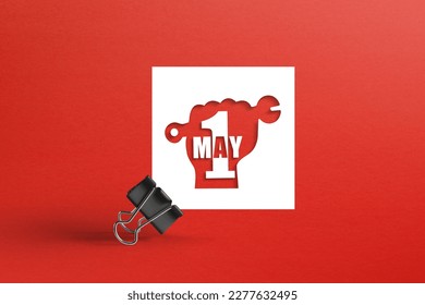 May 1 Labor Day concept on white note paper with metal clip - Shutterstock ID 2277632495