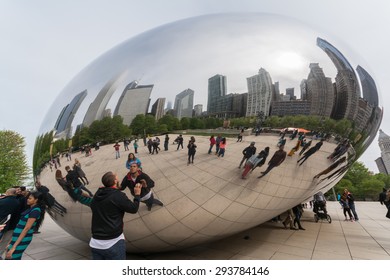MAY 10th 2015, CHICAGO: Tourists Taking Photo At The Cloud Gate Aka The Beans In A Cloudy Date, Illinois USA