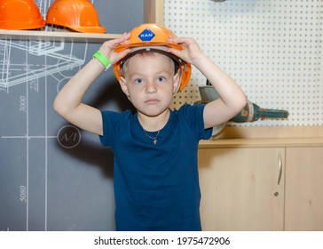 May 13, 2021 Kiev Ukraine. Little Boy In A Builder's Helmet.