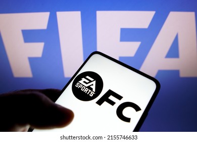 May 14, 2022, Brazil. In this photo illustration, the EA Sports FC logo seen displayed on a smartphone screen and in the background, the FIFA logo