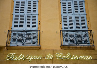 May 15, 2019. Artisan local almond sweets factory facade with ochre walls and the original store sign in the historic center of Aix-en-Provence Marseille, Provence-Alpes-Côte d'Azur, France.