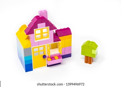 May 15, 2019 - Rome, Italy - Lego House Made Of Classic Colored Building Blocks, Isolated On White. Concept Of Home, Construction, Investment, Savings, Development, Family, Real Estate.