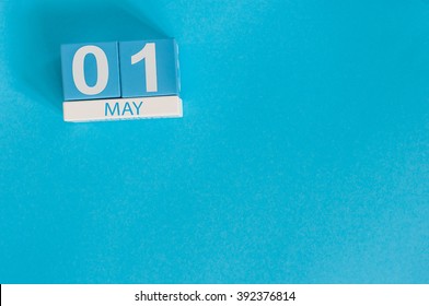 May 1st. Image Of May 1 Wooden Color Calendar On Blue Background.  Spring Day, Empty Space For Text.  International Workers' Day