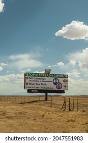 May 2, 2021, Cameron, Arizona, USA. Huge Billboard Sign On Navajo Indian Reservation Warning About Covid Spread And Encouraging Social Distancing. 