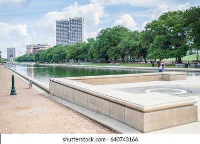 May 2017, Houston, Texas:  A Couple Embraces In Front Of The Mary Gibbs And Jesse H. Jones Reflection Pool At Hermann Park