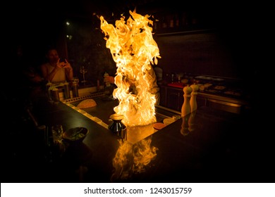 May, 2018 - Ari Atoll, Maldives: Happy Teppanyaki Chef Cooking Vegetables At Teppan In A Japanese Steakhouse On Mishi Sushi. Gourmet Food In Luxury Restaurant. 