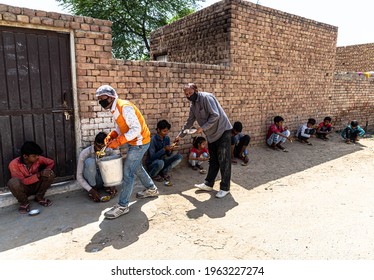 May 2020 Sirsa,india
Migrants Wait In Queues To Receive Food Being Distributed By The Volunteers During Covid19 Lock Down