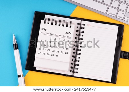 May 2024 calendar, notepad, pen and computer keyboard