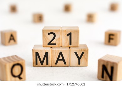 May 21 - from wooden blocks with letters, important date concept, white background random letters around - Shutterstock ID 1712745502