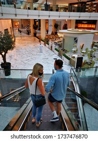 May 21st 2020, Dubai UAE, Two Shoppers Wearing Masks In An  Empty Dubai Mall Interior During The Pandemic Of Covid 19 2020.