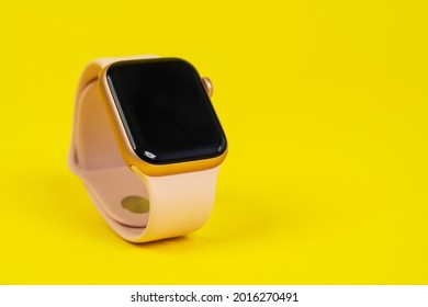 May 29, Rostov, Russia: Apple Watch Series 6 With Pink Rubber Strap On Yellow Background, Copy Space. Smart Device For An Active Lifestyle