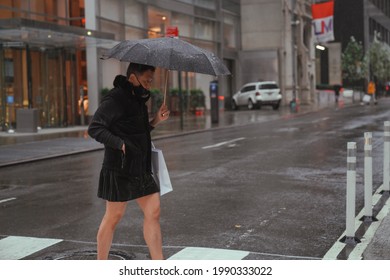 May 2nd, 2021 -  New York:   Transgender Man Walking On Rainy Day In Manhattan, New Yorker. Street Photography, Lgtb, Pride Concept. Self Confidence, Editorial