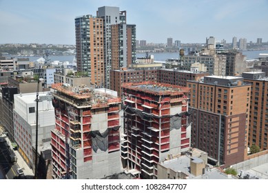 May 3, 2018, Hell's Kitchen, New York City, New York State .  Workers Working On Top Of A Pair Of Apartment Towers In The Clinton(Hell's Kitchen) Neighborhood Of New York City.