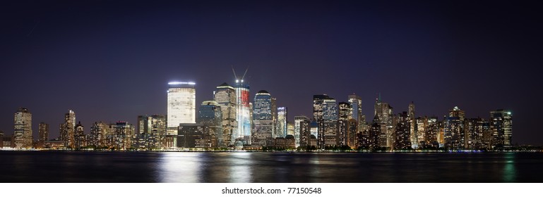 may 5, 2011. Manhattan, lower New York financial offices(downtown)  from Jersey city. One World Trade Center building under construction and color lighted. USA celebrates Osama Bin Laden Death
